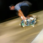 Stylized nighttime photograph of skateboarder Brian doing an old-school backside grab air at the Cocoa Beach Skatepark. Photograph by Sebastian Aravena.